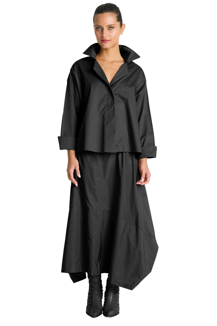 Woman wearing a 100% cotton black outfit on a white background