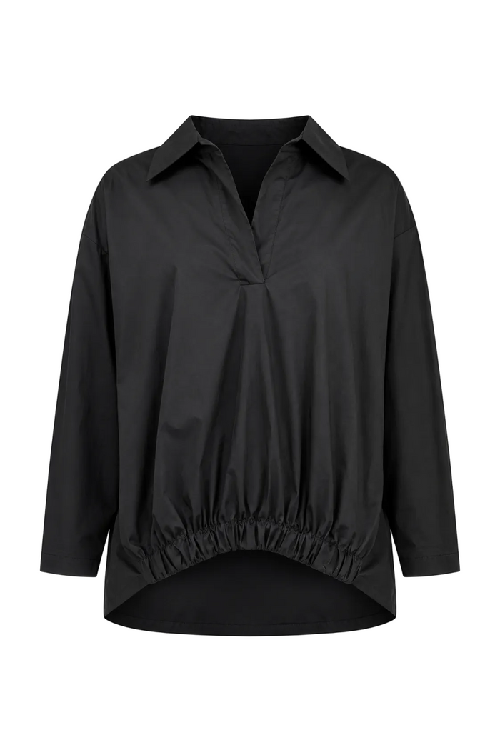 A black long-sleeve 100% cotton collared blouse with a gathered, ruched front and an elasticized hem, shown against a plain white background.