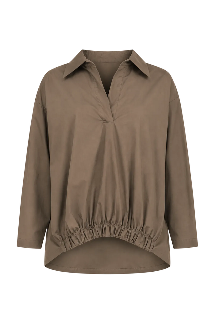 A 100% cotton taupe brown long-sleeve collared blouse with a gathered elastic hem, displayed on a clean white background.