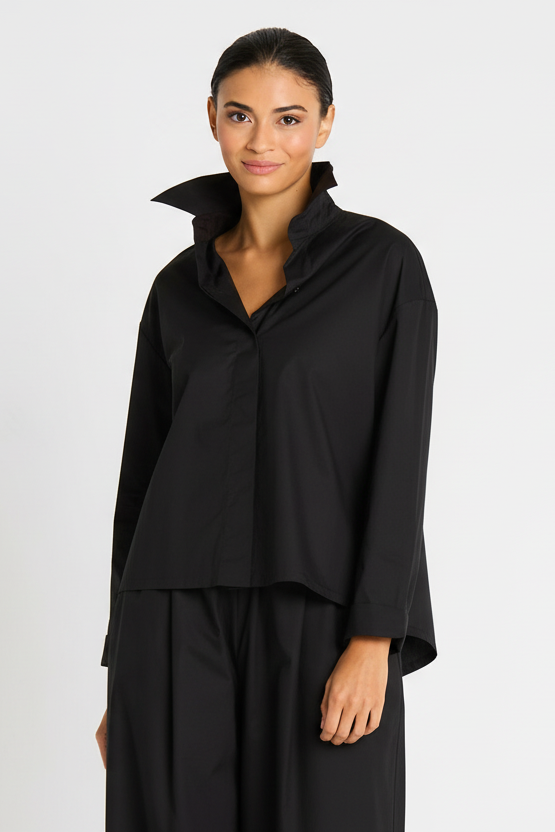Woman wearing a black cotton shirt on a white background