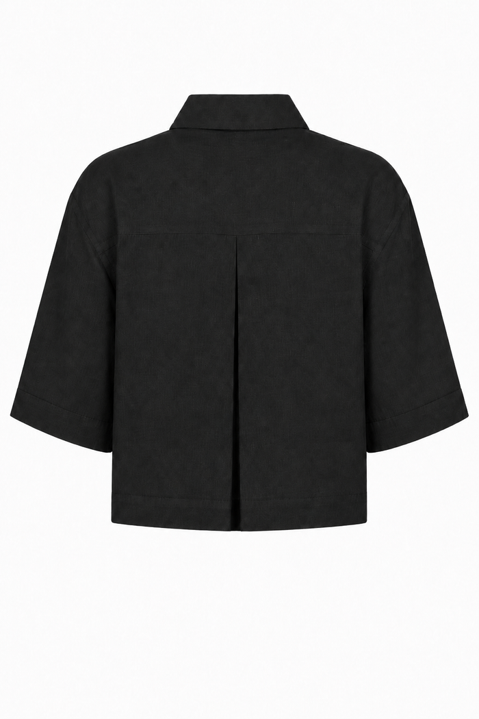 A black short-sleeve cropped jacket with a pointed collar and a central front seam, shown from the back on a plain white background.
