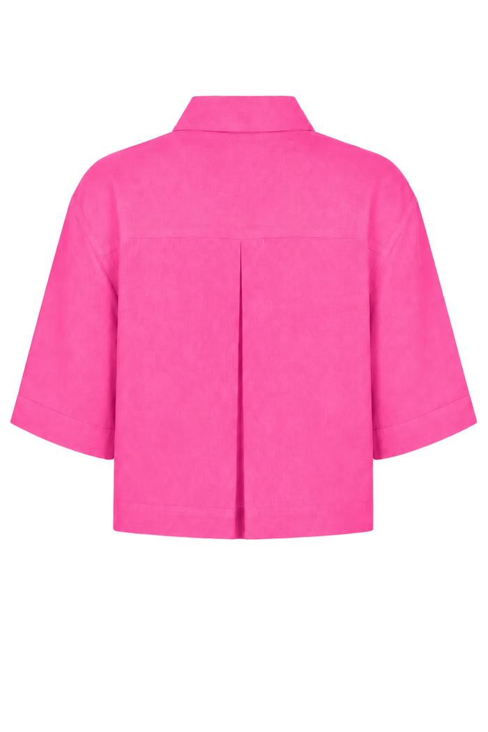 Bright pink short-sleeve 100% linen cropped shirt with a pointed collar and front pleat detail, shown from the back on a white background.