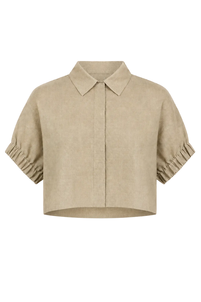 A cropped beige linen shirt jacket with a pointed collar, short sleeves featuring gathered ruffle cuffs, and a front button closure, shown against a plain white background.