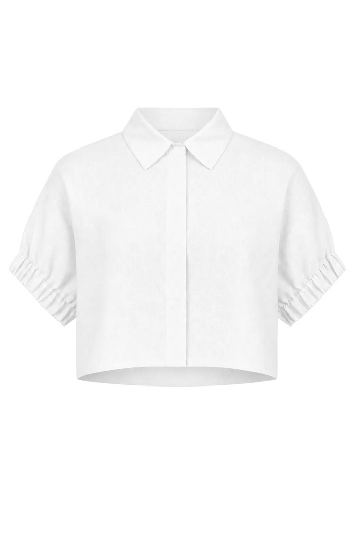 A 100% linen white short-sleeve collared shirt with gathered puff sleeves and a cropped hem, shown against a plain white background.