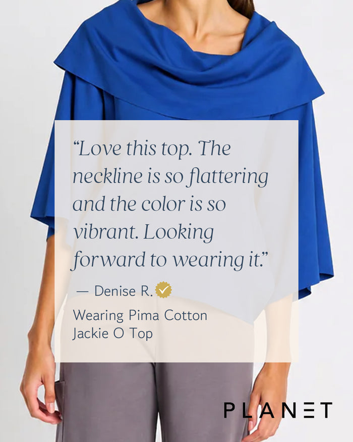 Person wearing a blue Planet pima cotton jackie o top with text reviewing the garment on a light gray background