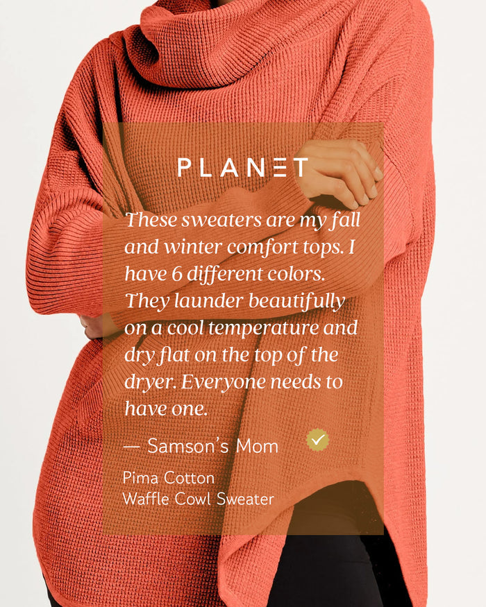 A person wearing a chunky knit cowl-neck sweater in a warm coral-orange color, with a translucent brown text overlay containing product details and the brand name PLANET.